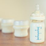 image of breast milk in bottles on counter showing breast milk color